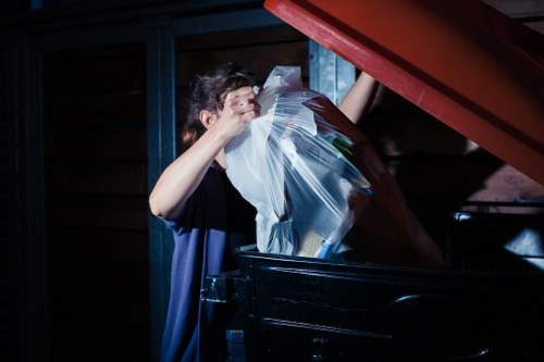 Staff sorting recyclable materials in a business backroom
